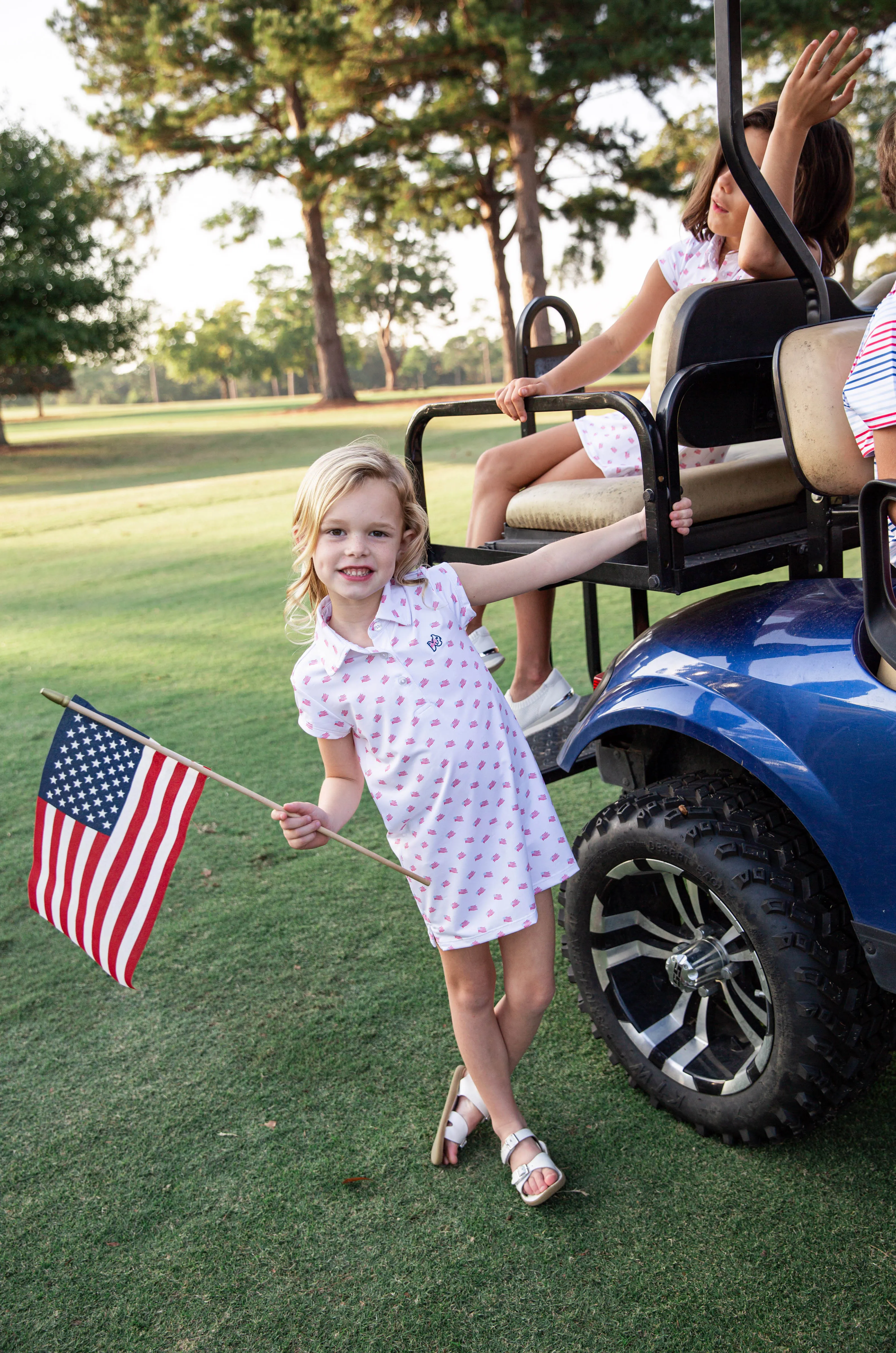 Girls' Short Sleeve Pro Performance Polo Dress in American Flag Print on White