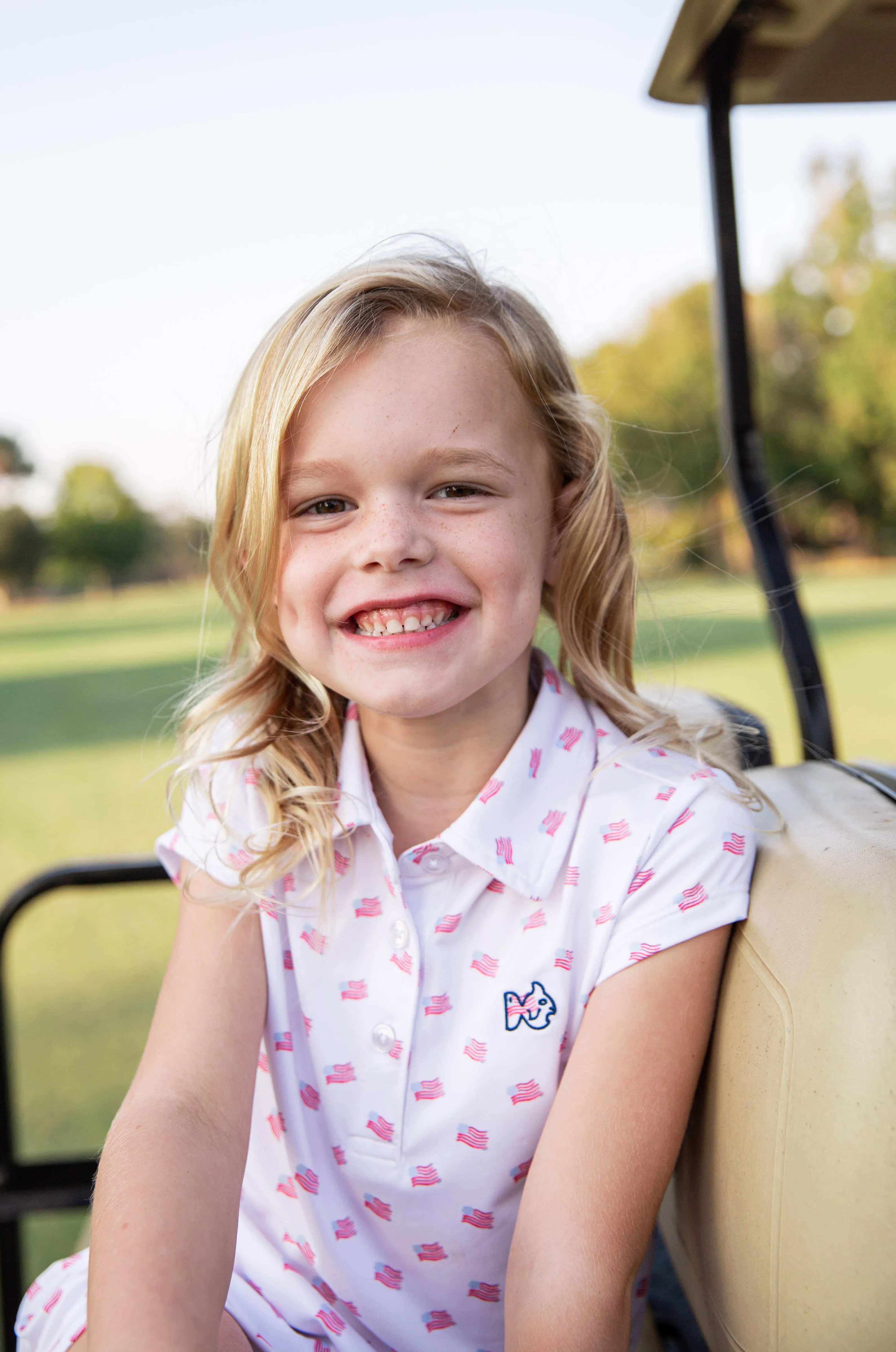 Girls' Short Sleeve Pro Performance Polo Dress in American Flag Print on White