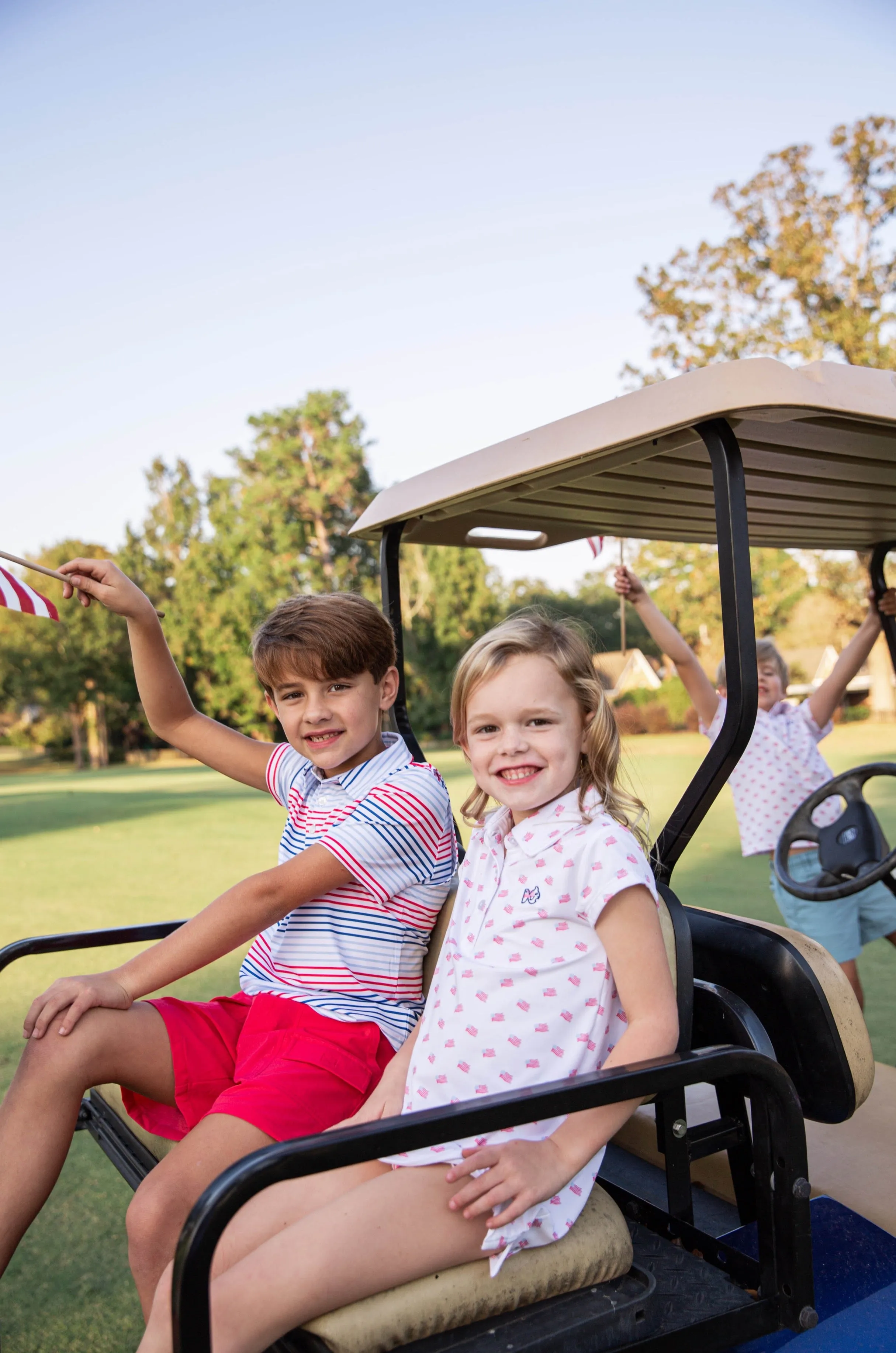 Girls' Short Sleeve Pro Performance Polo Dress in American Flag Print on White