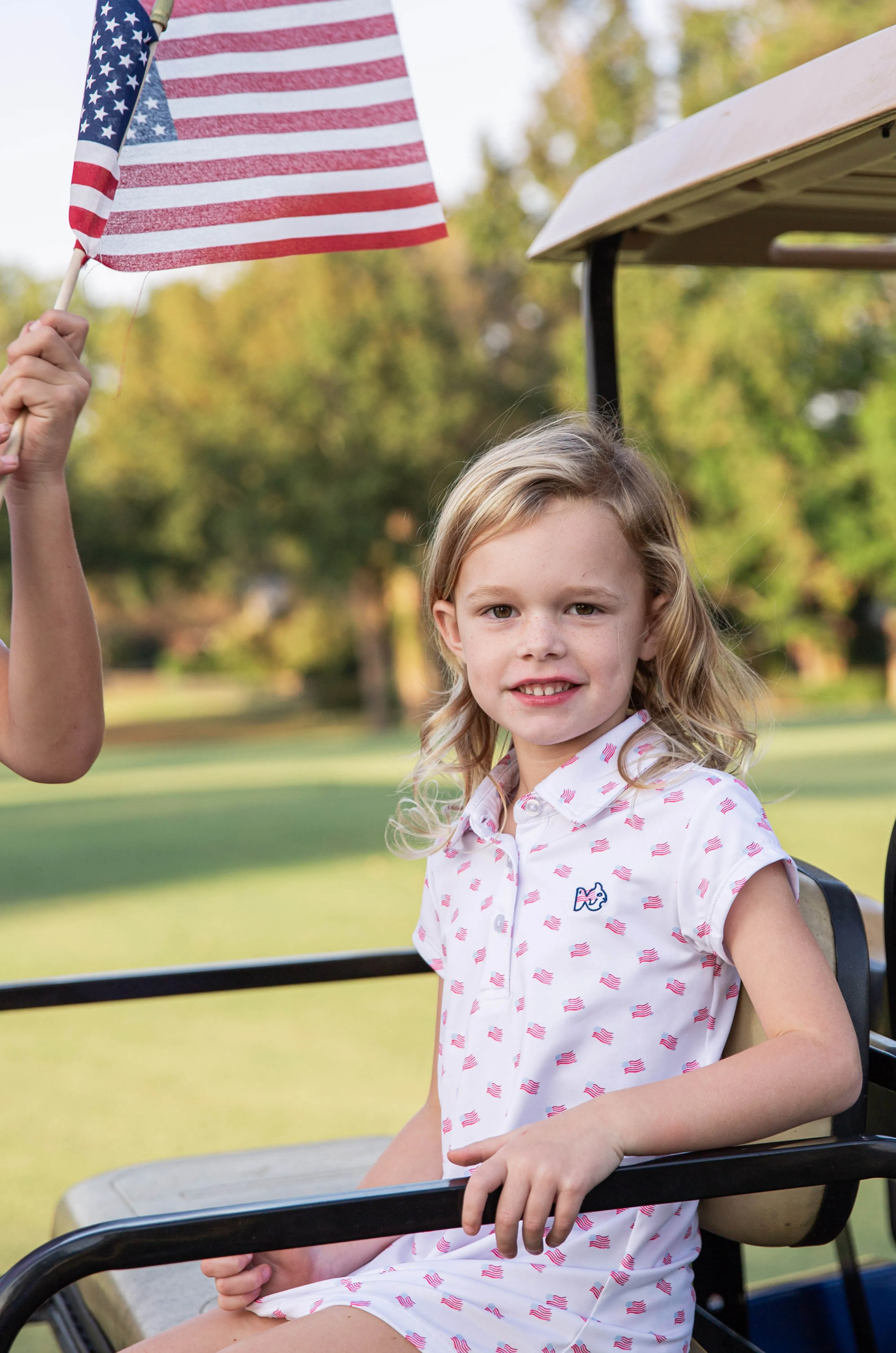 Girls' Short Sleeve Pro Performance Polo Dress in American Flag Print on White